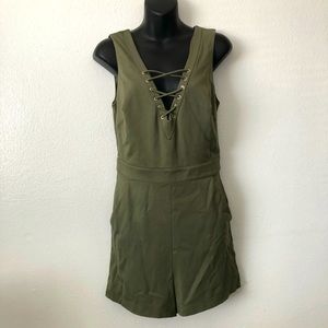 BEBE green jumpsuit size 8